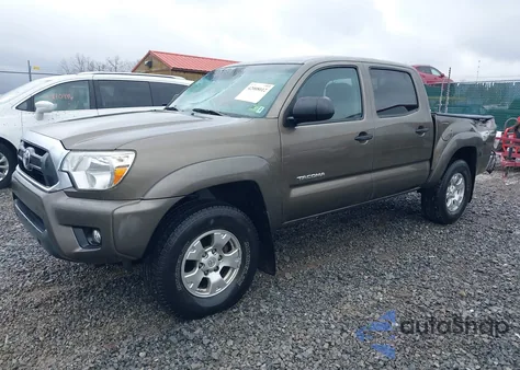 2015 Toyota Tacoma Base V6 z USA, uszkodzony, nr VIN 3TMLU4EN1FM201554